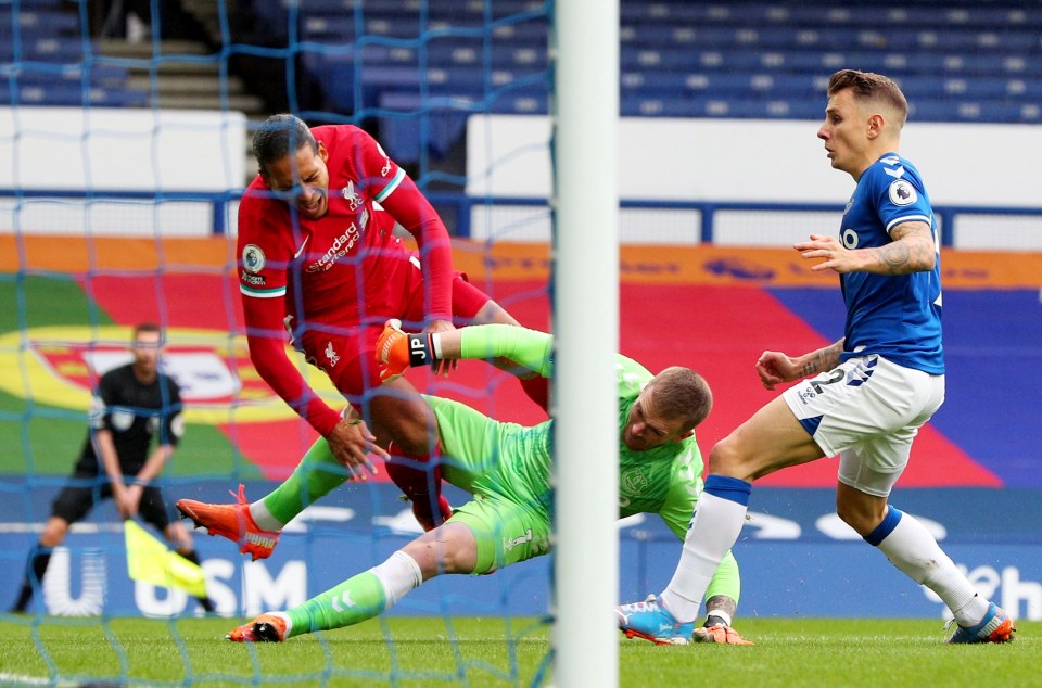 Liverpool's star defender Virgil van Dijk faces missing at least the rest of the season after this challenge from Jordan Pickford