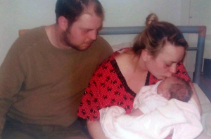 Danielle with partner Rob and baby Sadie who died while being transferred to another hospital