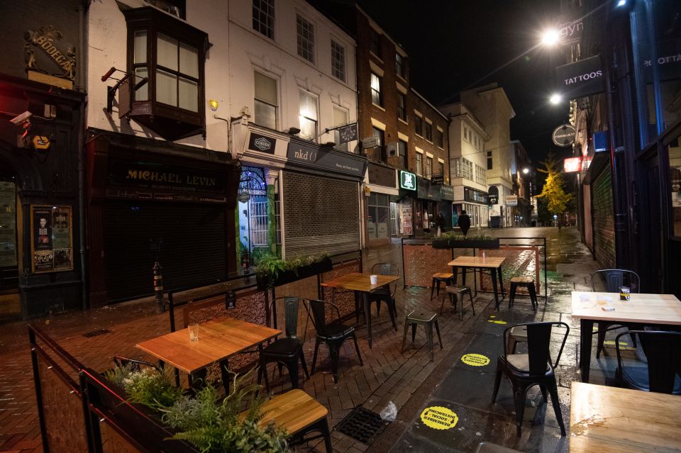  An empty seating area outside a bar in Nottingham as pubs and bars prepare to close their doors