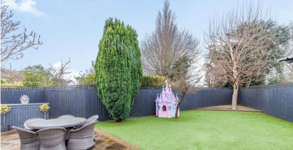  The big backyard features plenty of space for her kids to run around