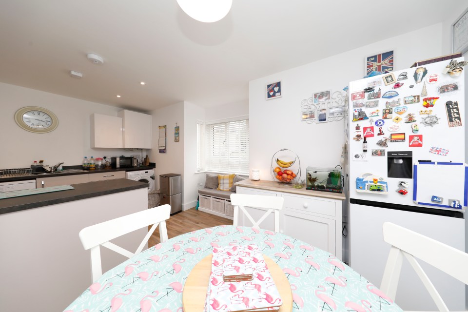 The kitchen has space for a dining table and chairs for the family