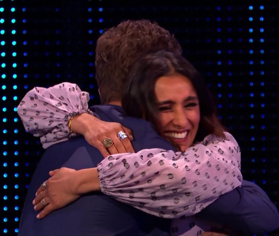 A delighted Anita Rani threw her arms around fellow player Mark