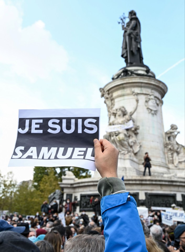 A demonstrator holds the words 'Je Suis Samuel' in support of freedom of speech