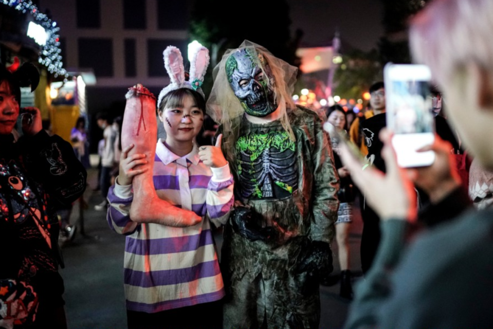 Celebrants kept close contact as they posed for pictures showing off their costumes 