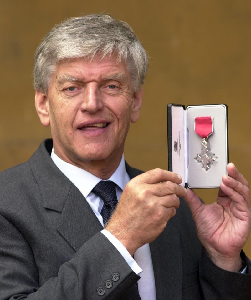 Actor Dave Prowse, pictured receiving an MBE for his work promoting road safety in 2000, has died aged 85