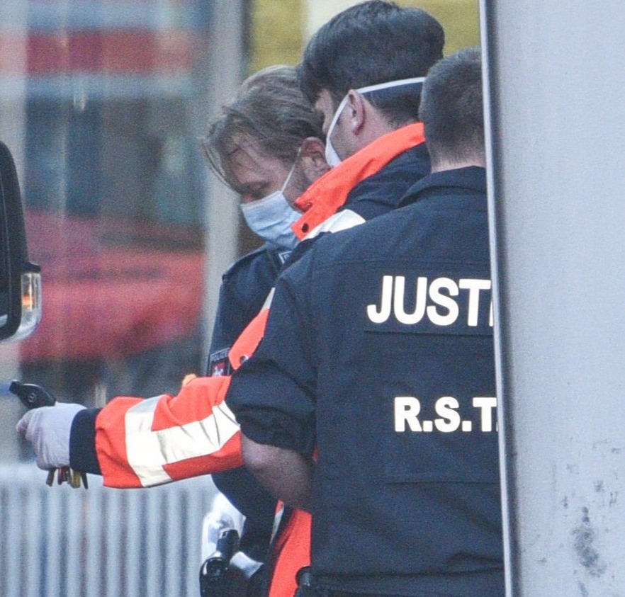 Christian B entering an ambulance after leaving the ER of a hospital in Braunschweig