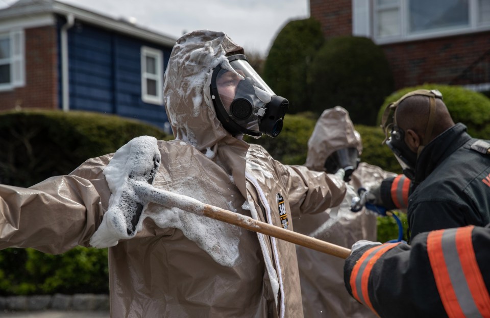 Firefighters decontaminating their PPE - which Biden wants to drastically increase the supply of