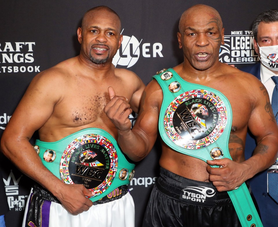 The two boxing legends show off their special WBC belts they received