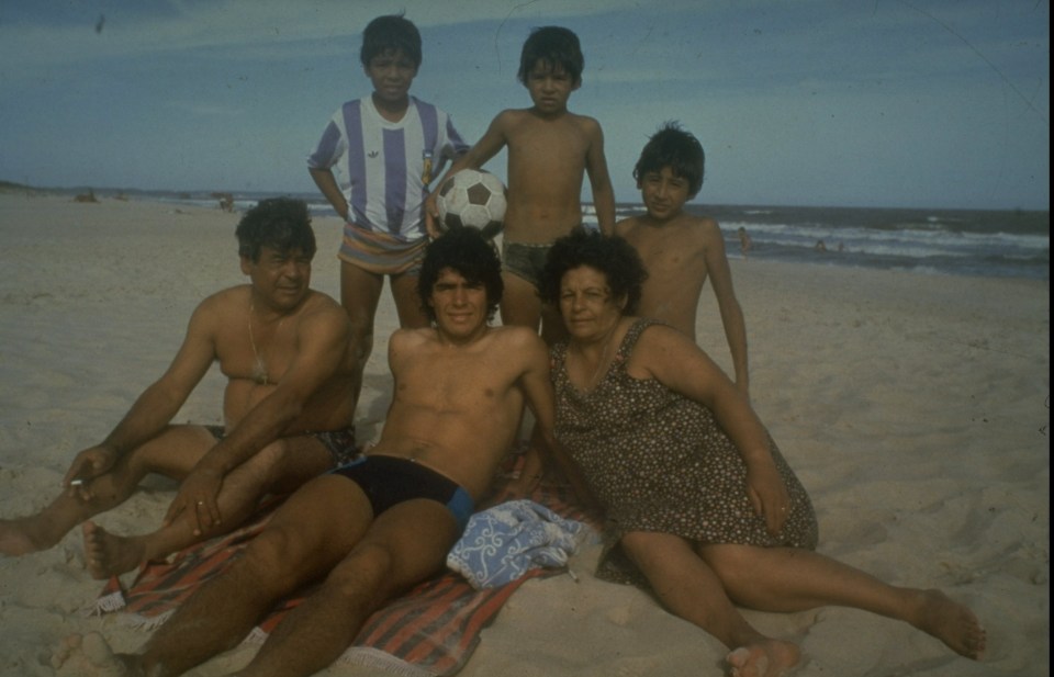 A young Maradona surrounded by his family on a beach in Argentina 