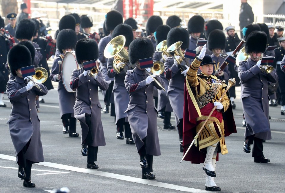 Military personnel march past during the National Service of Remembrance at the Cenotaph