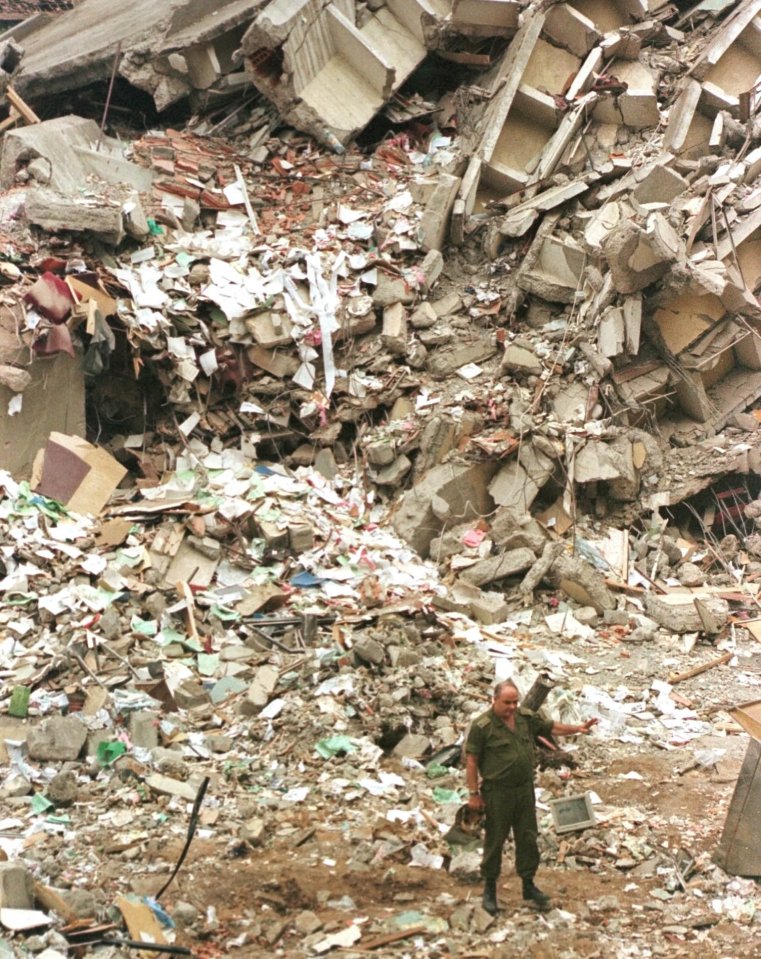 A soldier stands amid the rubble that once was a building standing next to the US Embassy in down-town Nairobi in 1998