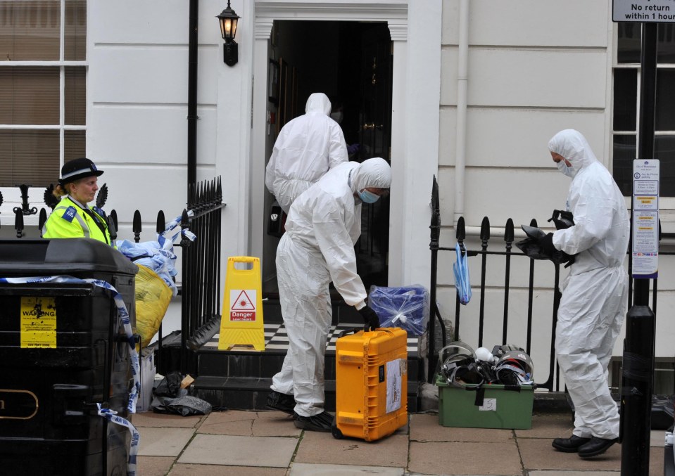 Forensic workers enter Gareth Williams' flat in Pimlico, London