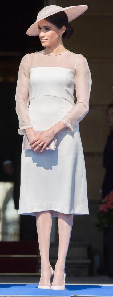 Meghan pictured in a pair of nude tights at Prince Charles' 70th birthday in May 2018