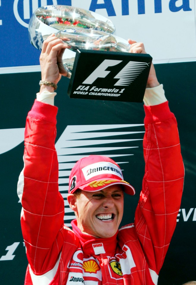 Schumacher raises the trophy after winning the French Formula One Grand Prix in 2006