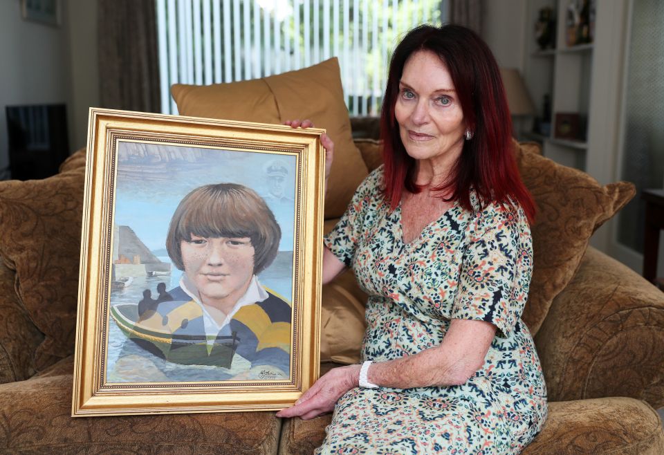 Mum Mary with a picture of Paul 