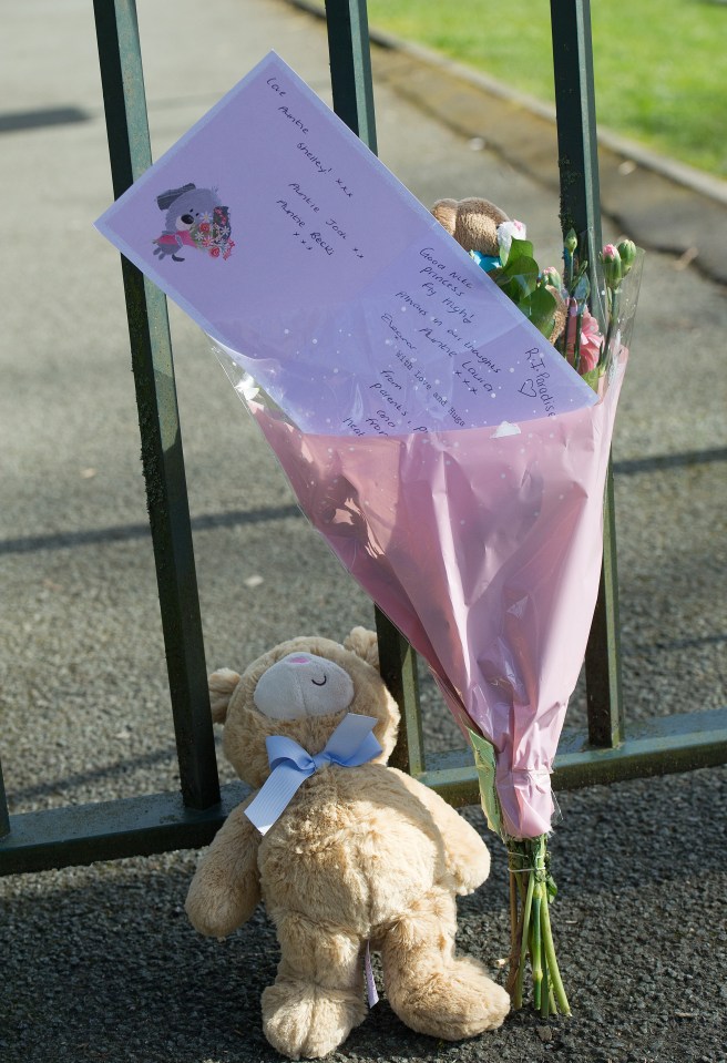 A teddy bear and card left at the Bolton park after Emily's death