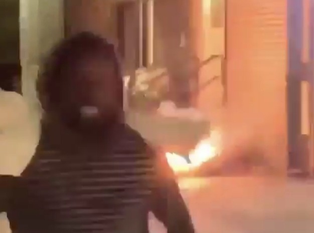 A homeless man is set on fire after thugs shoot fireworks at him