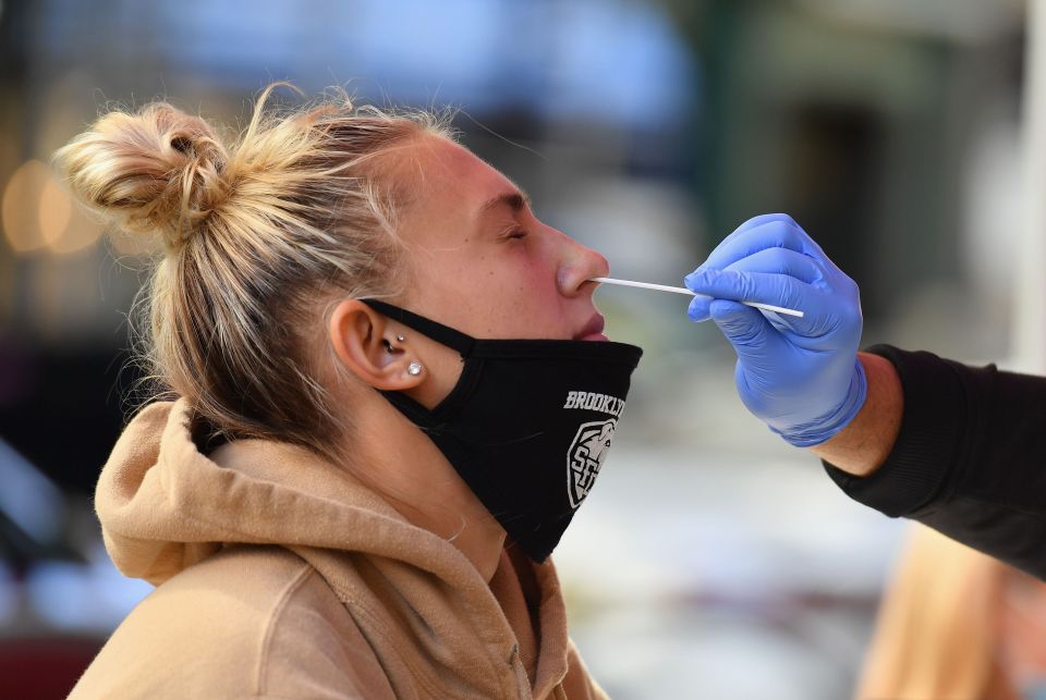 A student receiving a coronavirus test in New York - Biden plans to expand testing