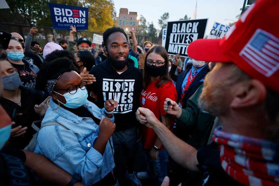 Supporters of Joe Biden clash with Donald Trump voters