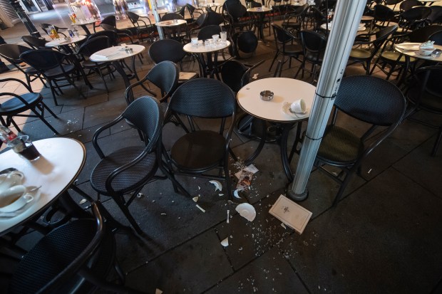 Tables and chairs are abandoned following the terror attack