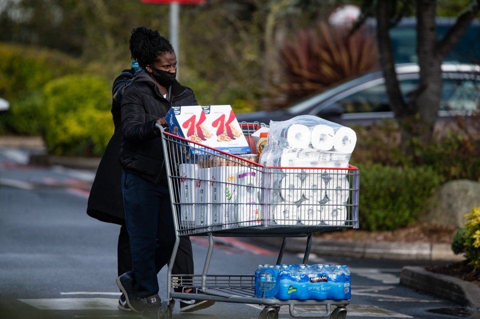 Another shopper leaves with a full trolley