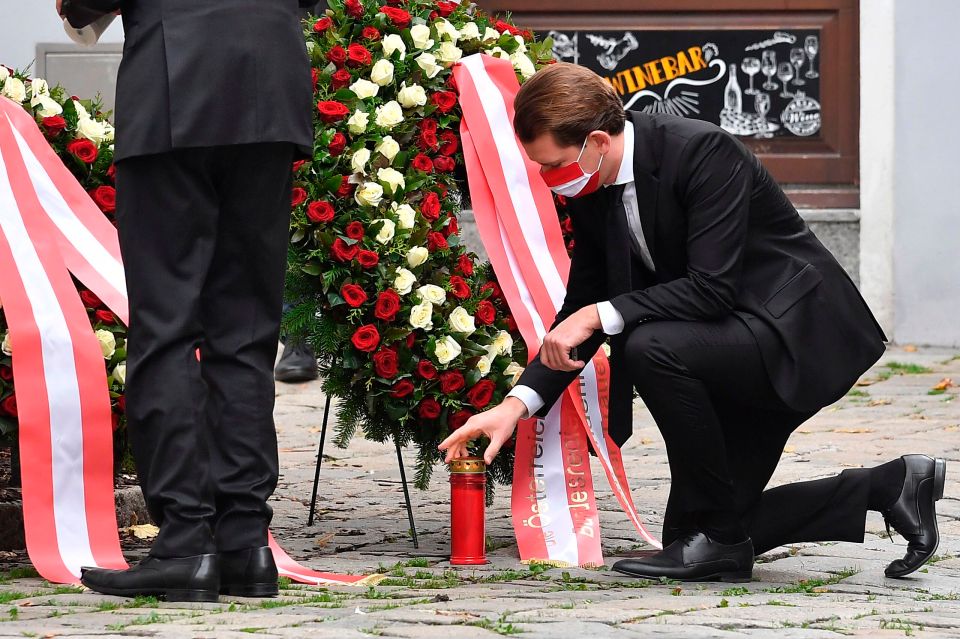 Austrian chancellor Sebastian Kurz places a candle at the crime scene 