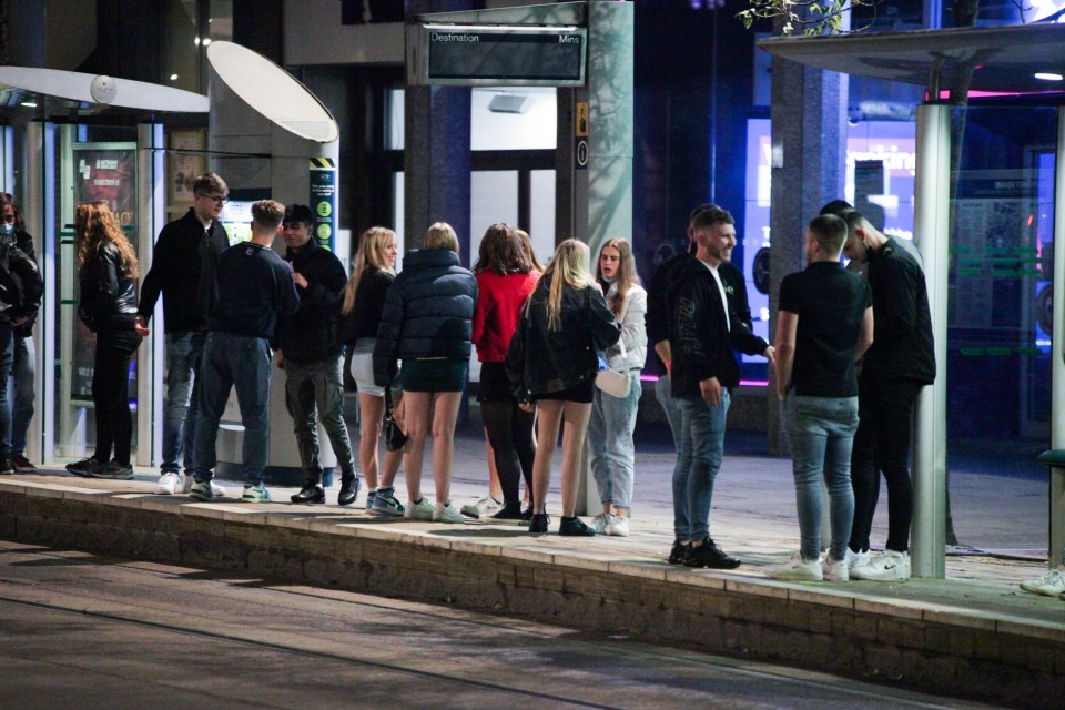 Friends are seen chatting as they enjoy a night on the town 