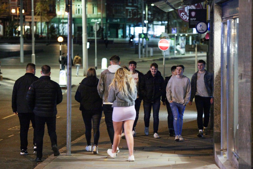 A group make their way through the streets of Nottingham as the country prepares to go into lockdown