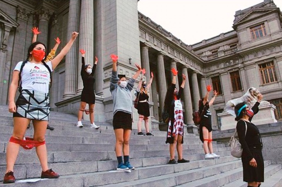 Protesters wearing red knickers demonstrate against a controversial rape ruling by a court in Peru