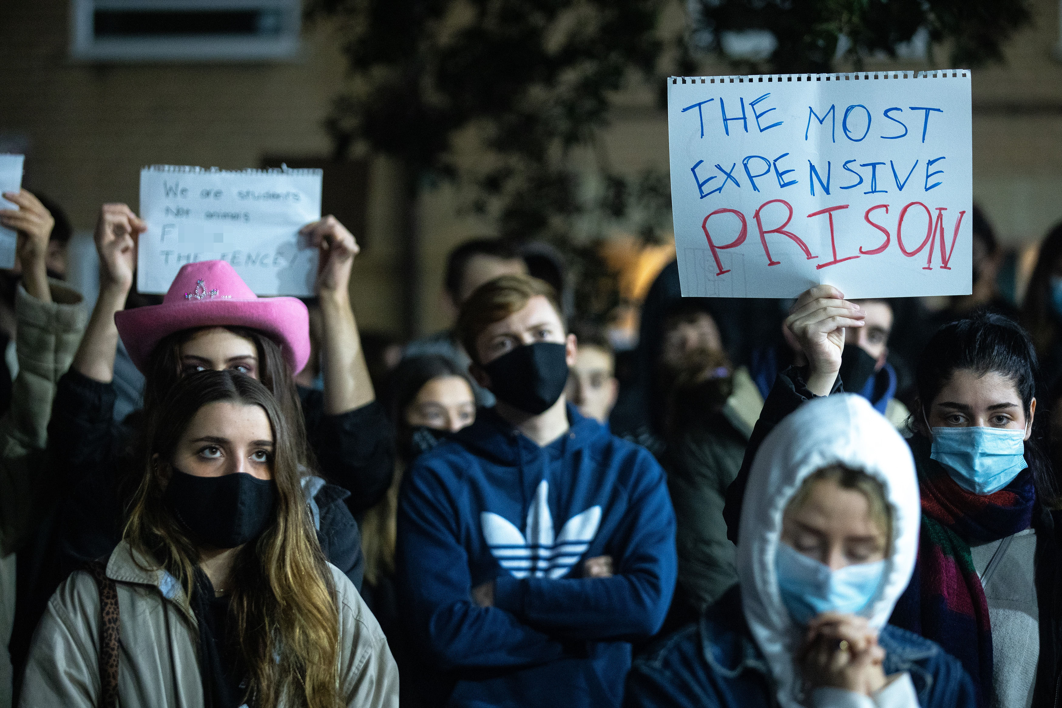 Students protested in crowds against being ‘trapped inside’ at the campus