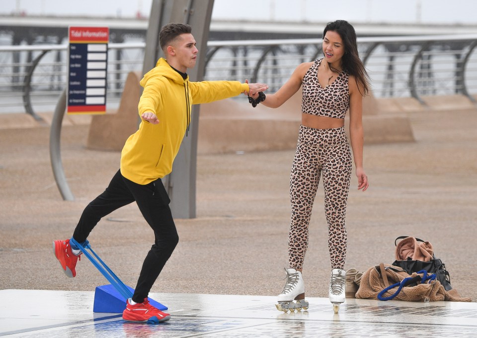 Vanessa Bauer, 24, instructs Joe as he exercises at Blackpool seafront