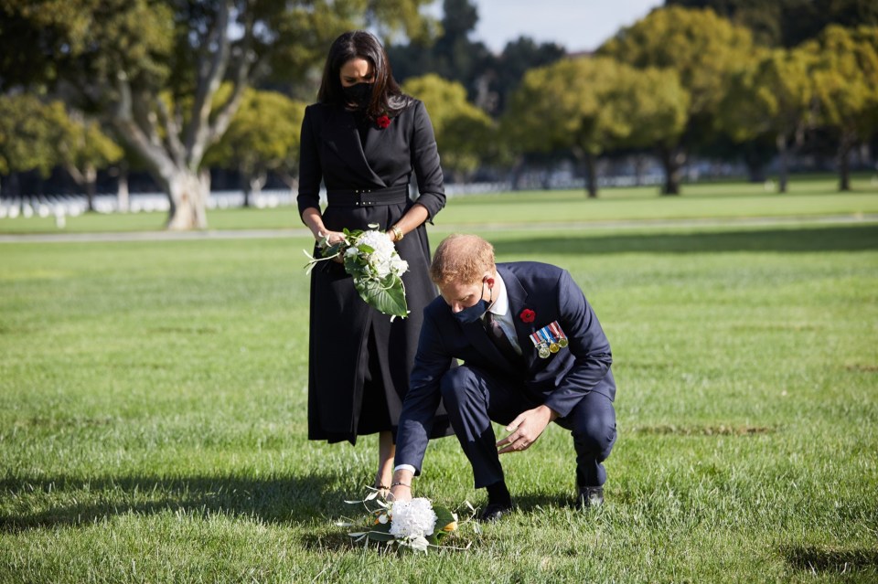 The Duke and Duchess of Sussex were pictured laying flowers at the Los Angeles National Cemetery