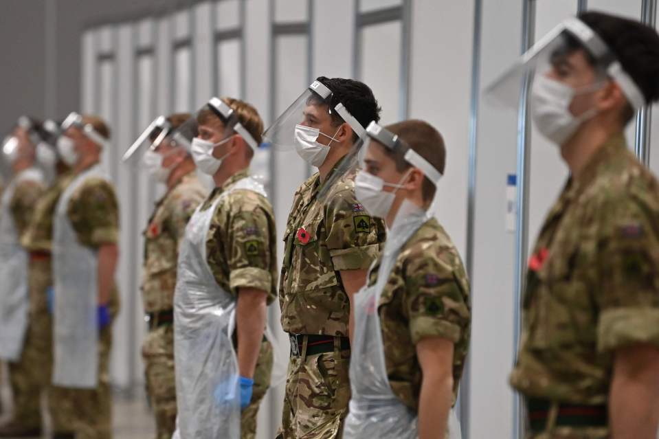 Soldiers working on the coronavirus front line stepped away from their stations to mark the silence