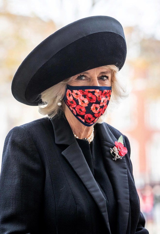 Camilla wore a special patterned poppy mask for the service 