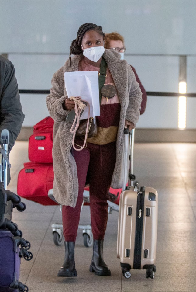 The Strictly judge rushed to Germany (seen at Heathrow airport)