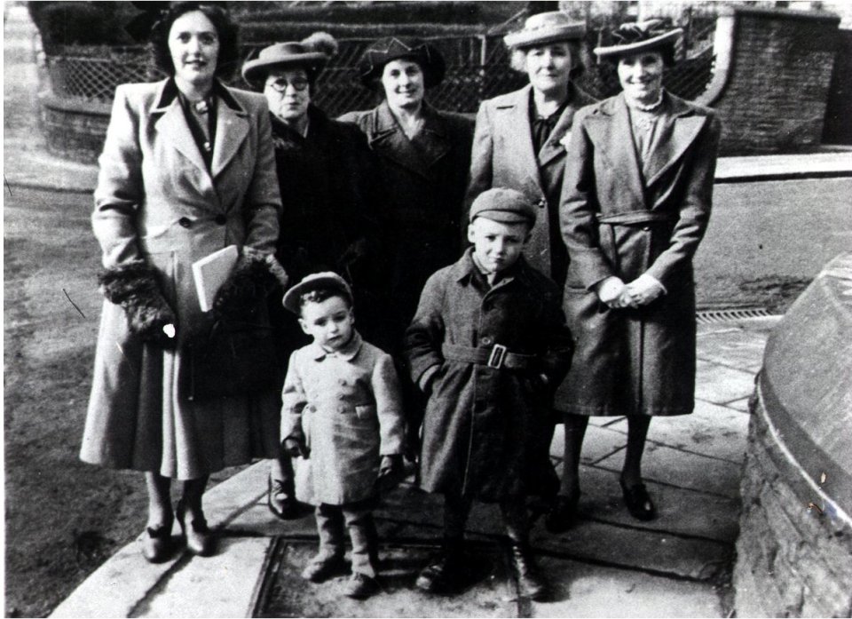 Peter, aged three with mum Kathleen (far left) and family members