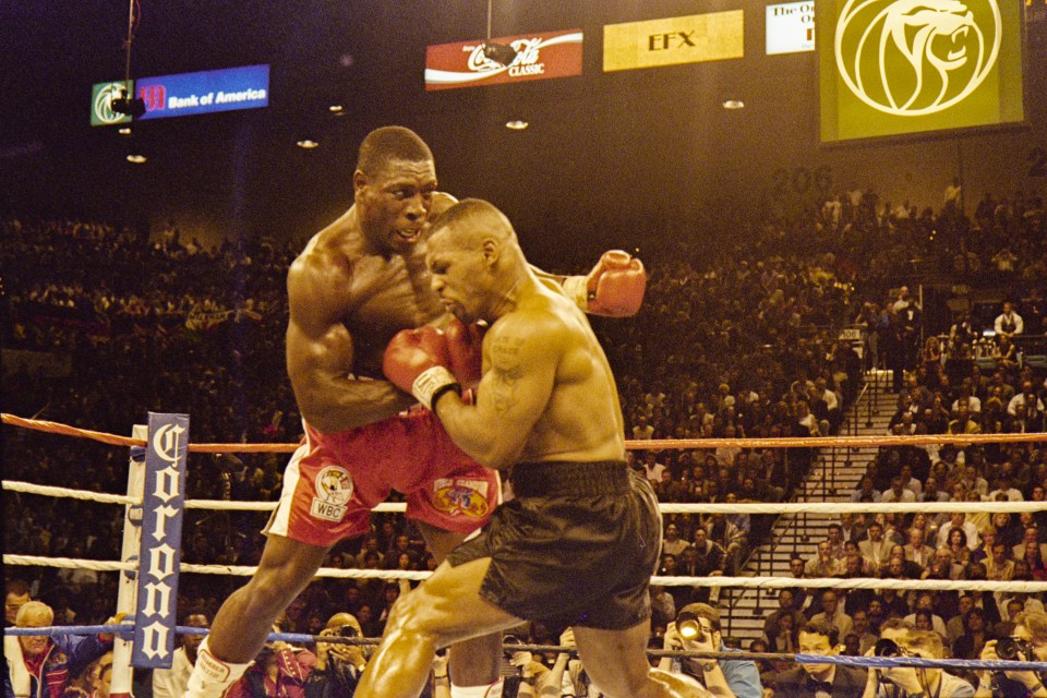 Frank Bruno lands a blow in 1996 rematch with Tyson