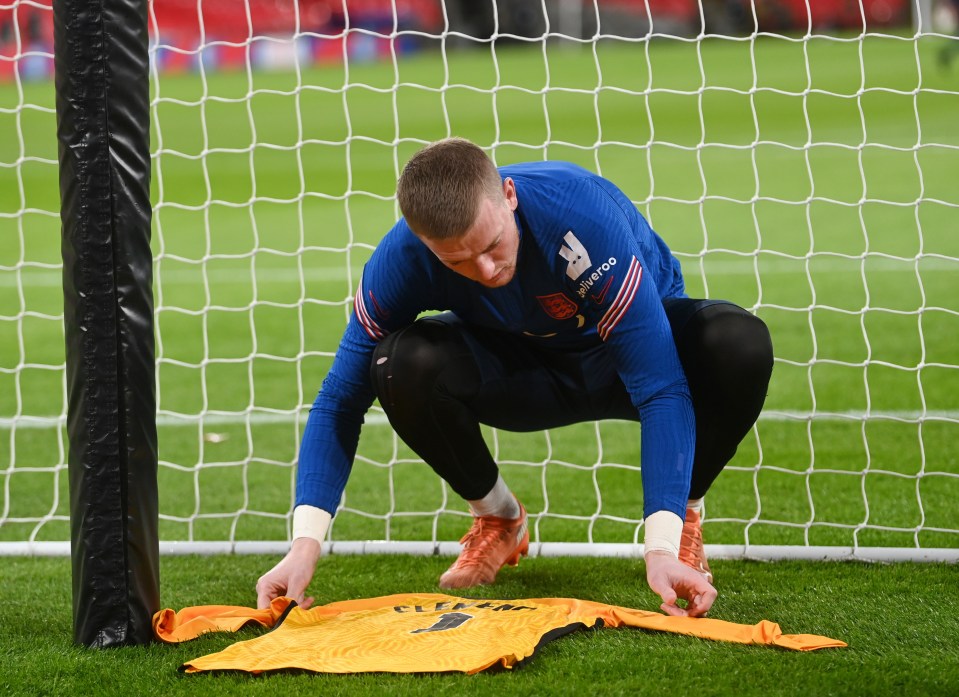 Pickford laid down a Clemence No1 England shirt behind the net