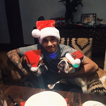 Lewis Hamilton poses for a snap with his beloved pet pooches