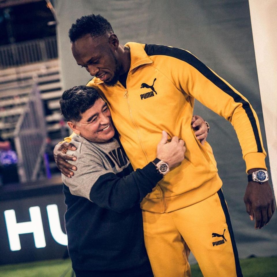 The world's fastest man Usain Bolt enjoys a cuddle with Maradona - whose spirit transcended sport 