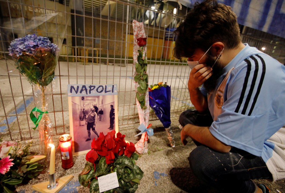 A man weeps outside outside San Paolo stadium in Naples after the death of Napoli legend Maradona 