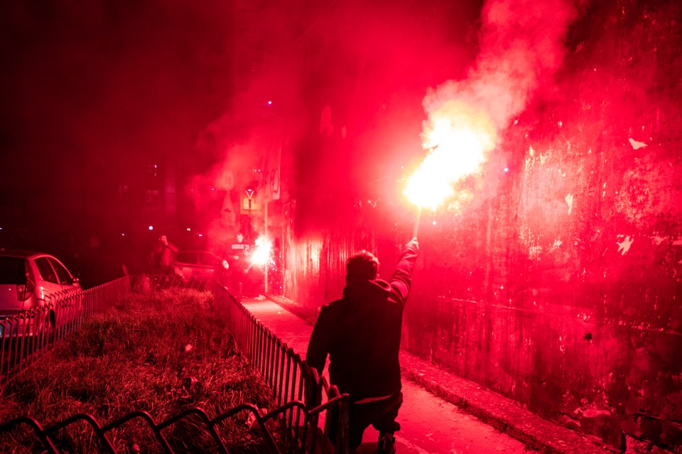 Fans lit flares all throughout the streets in tribute to the fallen legend