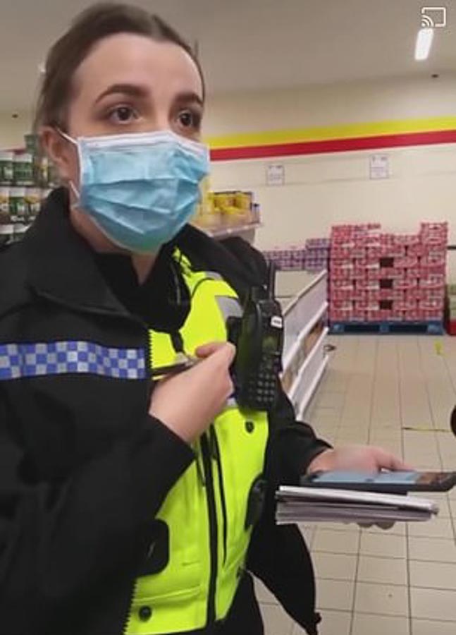 The young police officer is seen on camera talking to the female customer