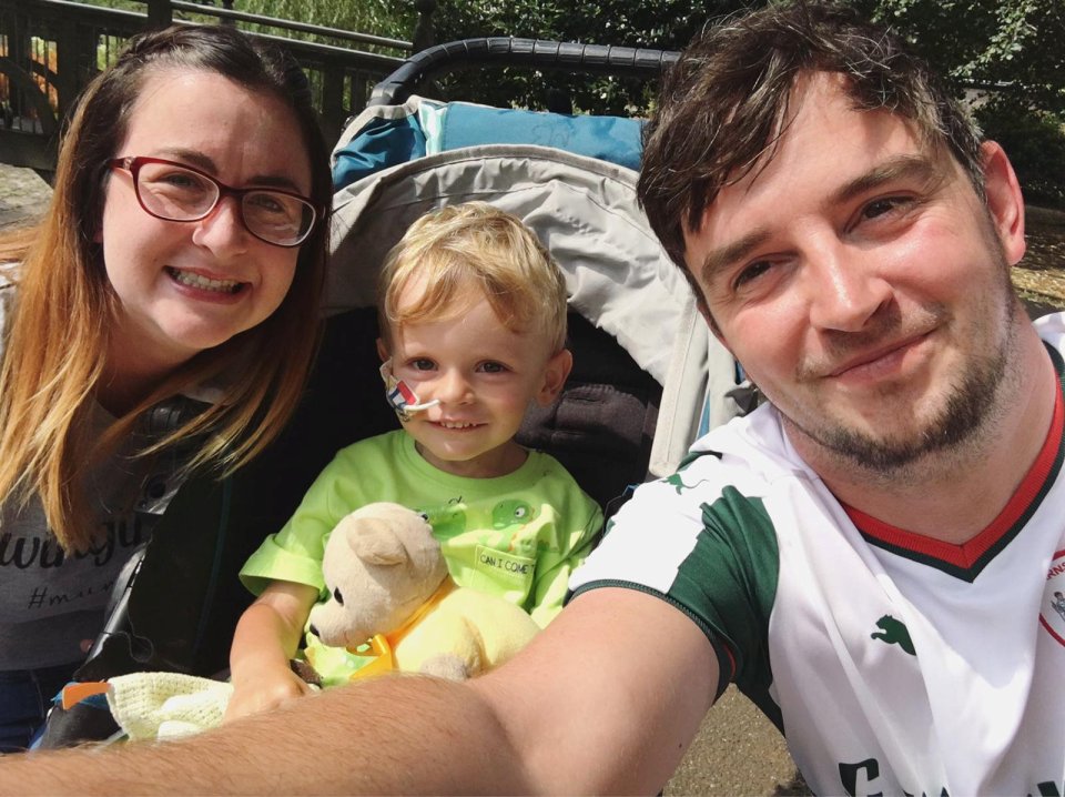 Alfie with his mum and dad Emma and Aaron Powell