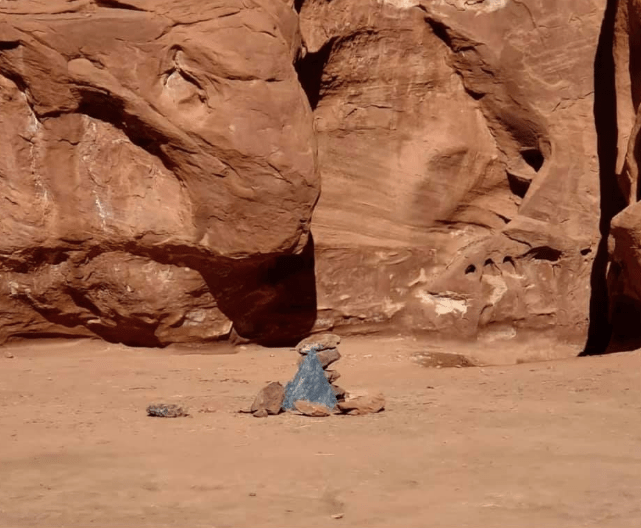 Images apparently from the site show a pile of rocks and a small piece of metal left behind