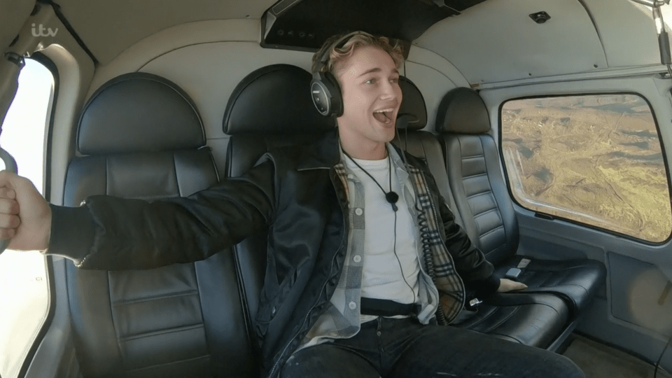 AJ Pritchard holds on for dear life as the helicopter swoops over Snowdonia