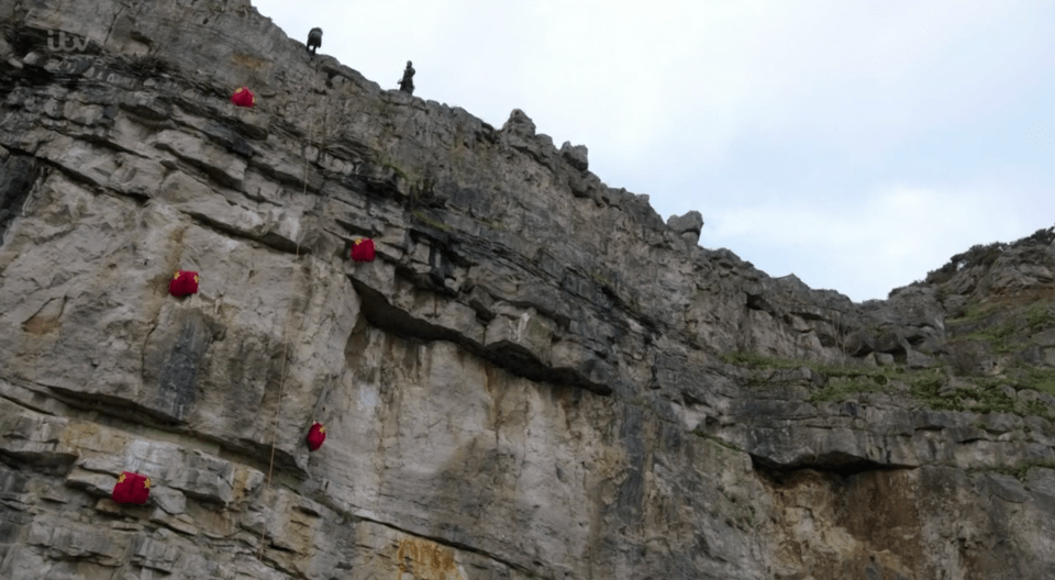 The rucksacks were hanging on the cliff face