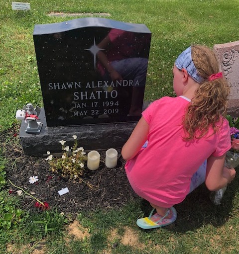 Jackie believes, if it wasn't for the forum, Shawn 'would be here'. Above, Shawn's younger sister visits her gravestone