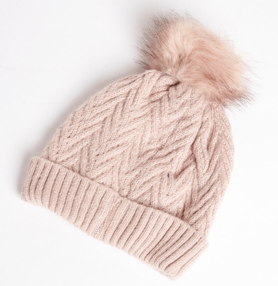 Treat the bobble hat as if it were oblong shape for a simple and smart look