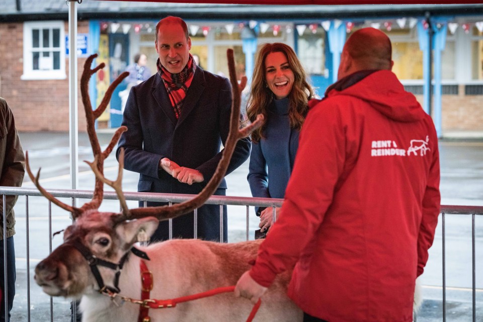 Kate Middleton and Prince William grin as they meet the reindeer